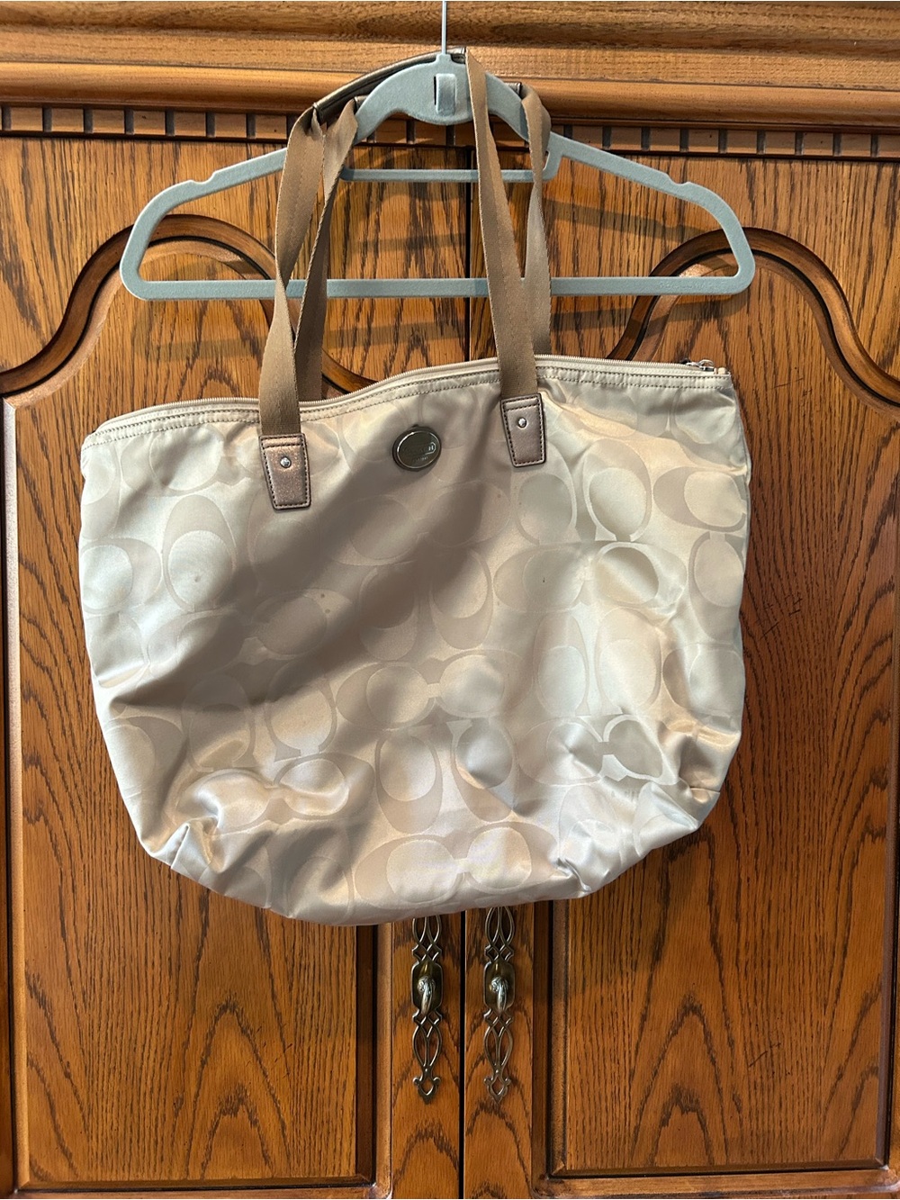 Coach cream stamped vinyl handbag
